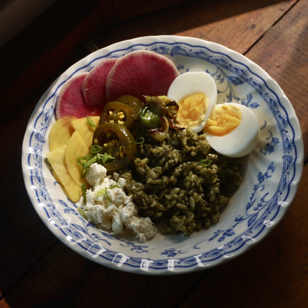 Pesto breakfast bowl with pickled beets, radish, sheep's milk feta, cowboy candy peppers, and soft-boiled egg