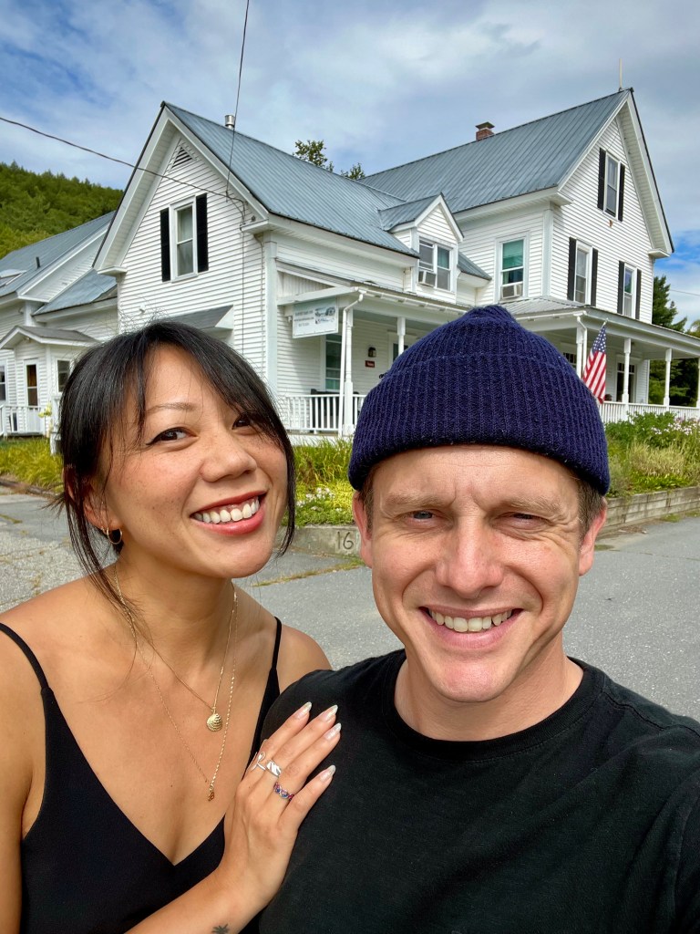Picture of innkeepers Blessing Yen Smith and Kaelan Yen Smith standing in front of the Harvest Barn Inn